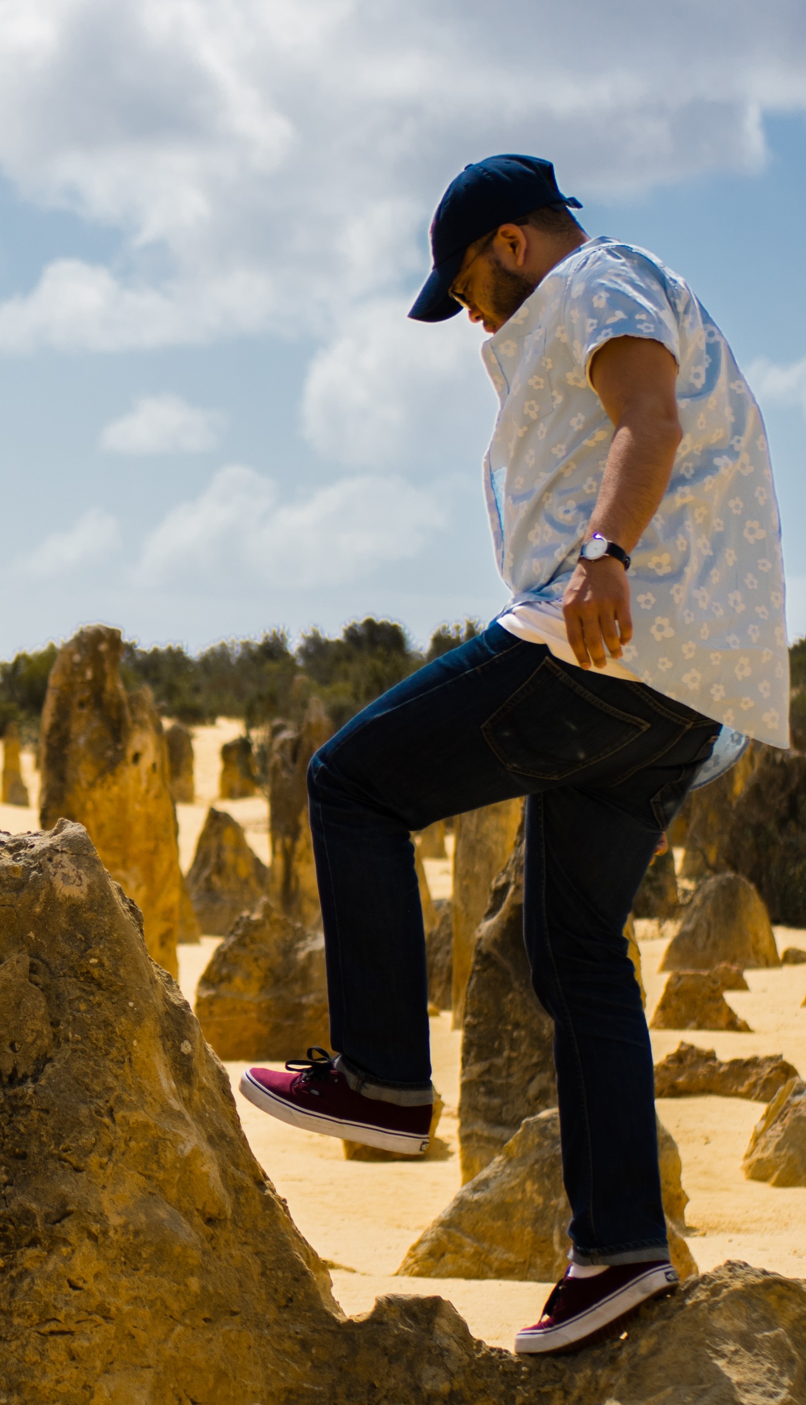 Marcos stepping on a rock
